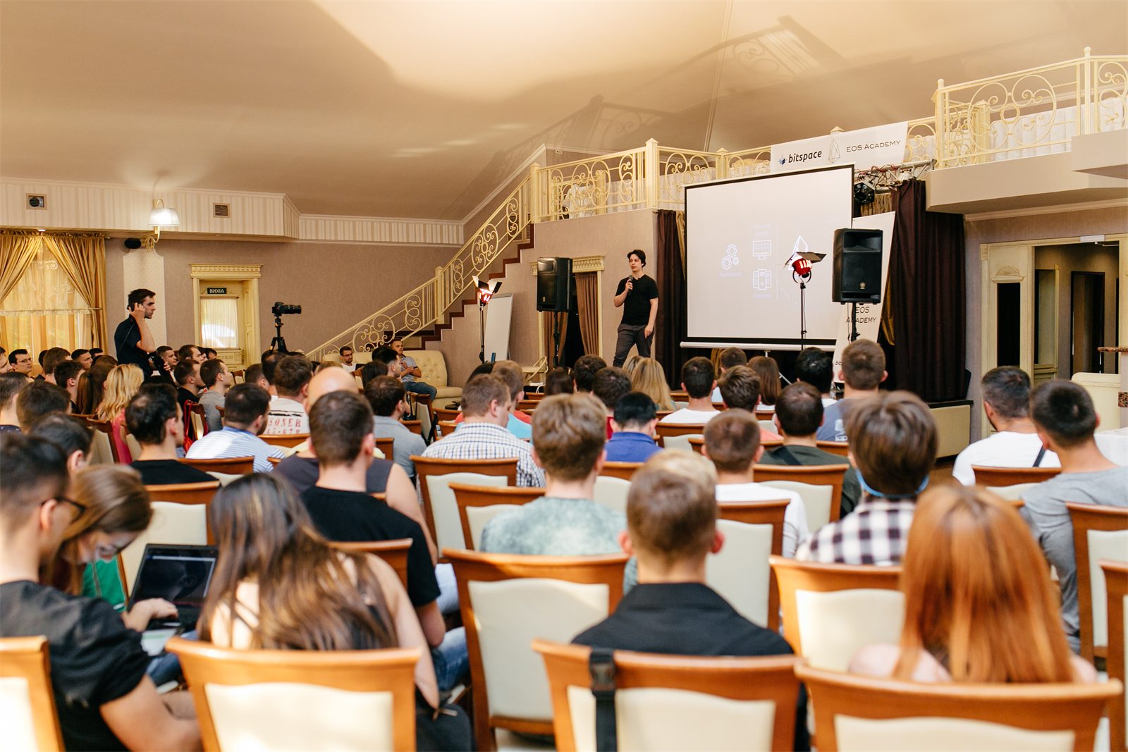 Christian Lains speaking to an audience at a BitSpace and EOS Academy event